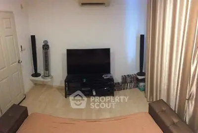 Cozy living room with modern entertainment setup and sleek decor