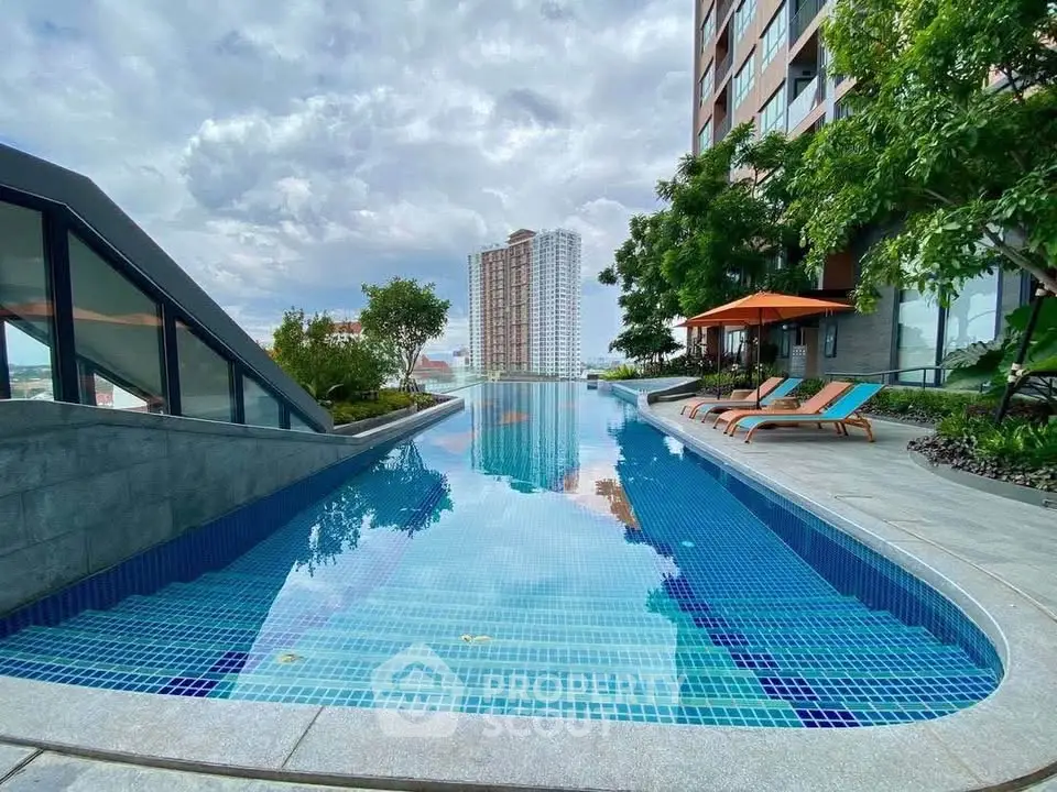 Luxurious apartment complex with stunning outdoor pool and city views.