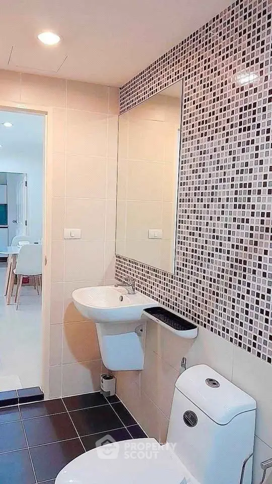 Modern bathroom with stylish mosaic tiles and sleek fixtures