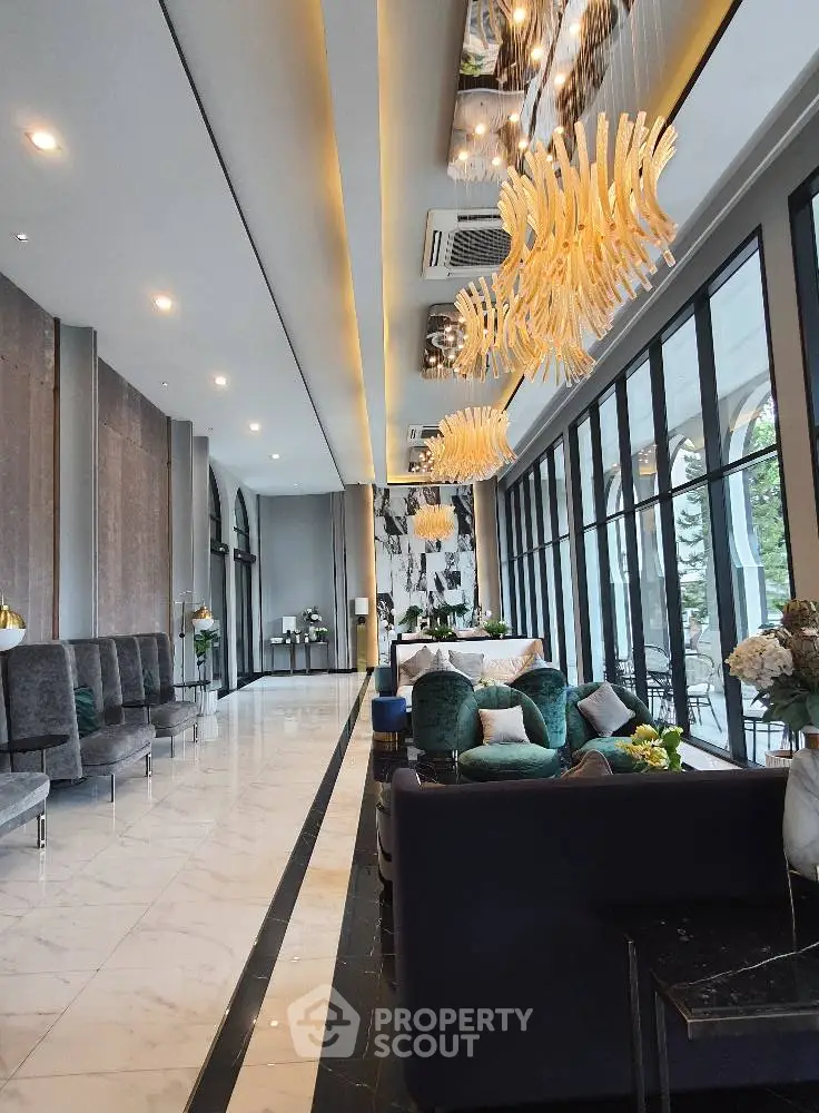 Luxurious modern living room with elegant chandeliers and floor-to-ceiling windows