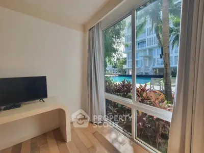 Bright living room with pool view and modern decor