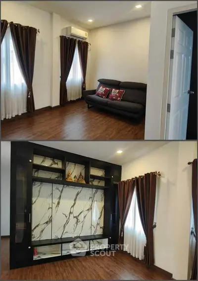 Spacious living room with elegant curtains and modern sofa, featuring stylish marble accent wall.