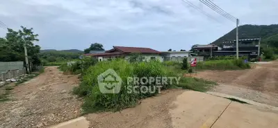Scenic rural property with lush greenery and mountain backdrop, ideal for serene living or investment.