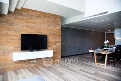 Modern living room with wooden accents and dining area in open layout