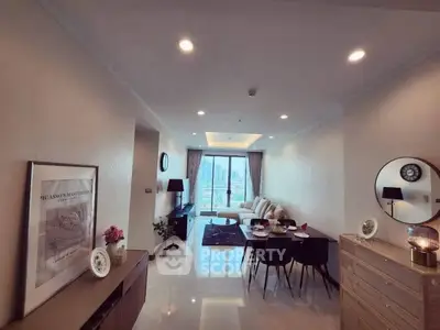 Spacious modern living room with elegant decor and city view.