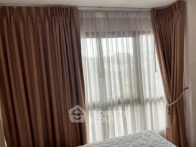 Cozy bedroom with elegant curtains and natural light