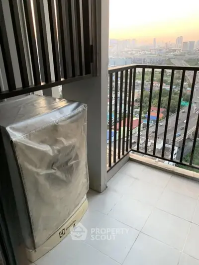 Modern balcony with city view and washing machine, perfect for urban living.