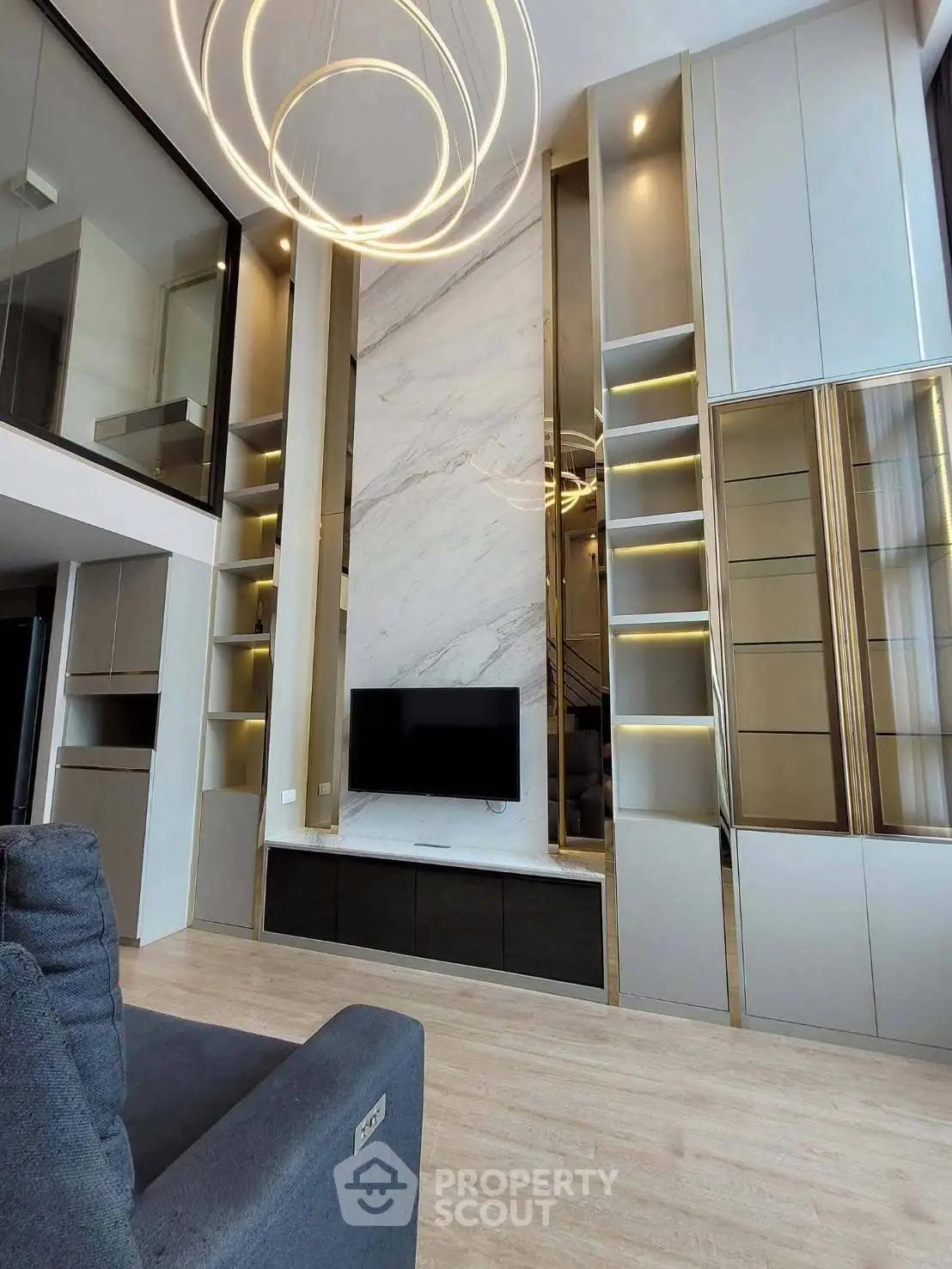 Luxurious modern living room with high ceilings and elegant lighting