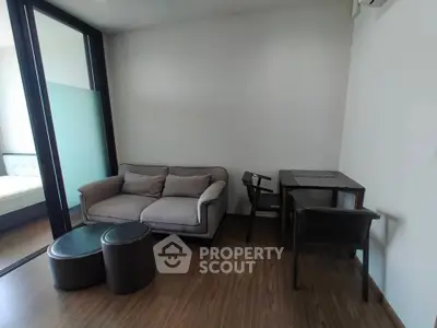 Cozy modern living room with stylish furniture and wooden flooring, perfect for relaxation and comfort.