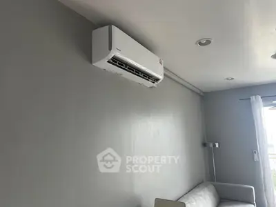 Modern living room with sleek air conditioning unit and minimalist decor