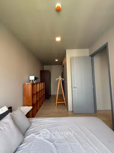 Spacious bedroom with modern decor and ample natural light