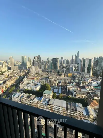 Stunning cityscape view from high-rise balcony in urban skyline.