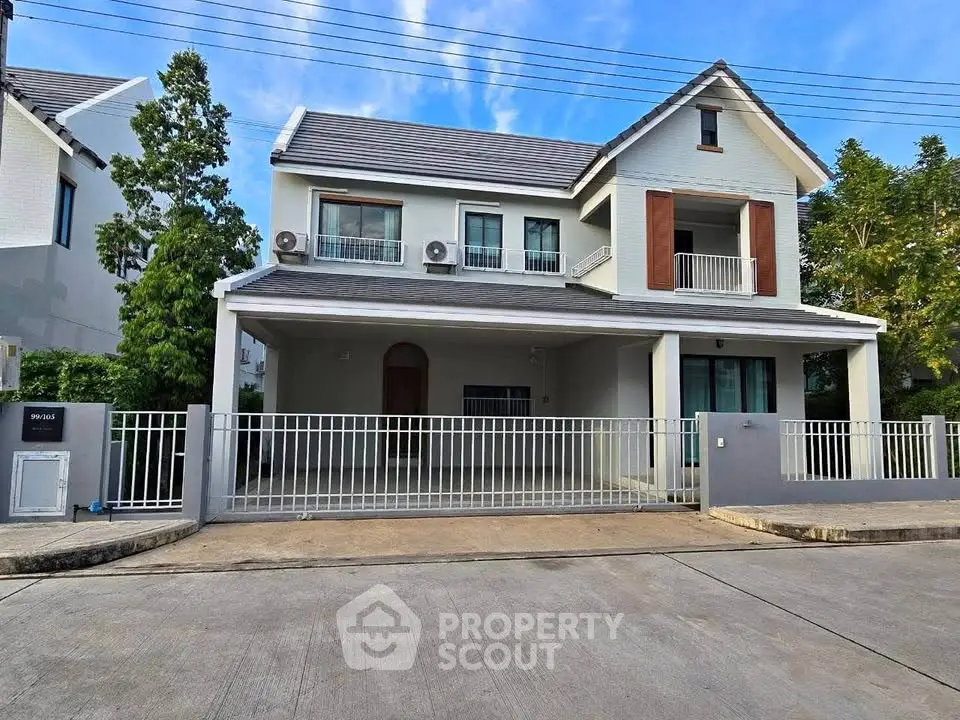 Charming two-story house with spacious driveway and modern exterior design in a serene neighborhood.