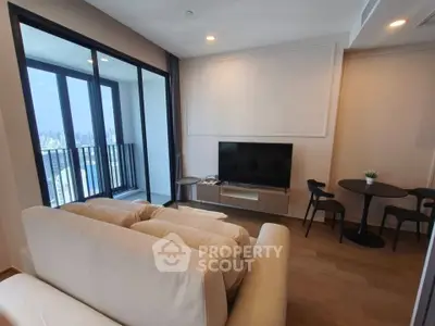 Modern living room with balcony view in high-rise apartment