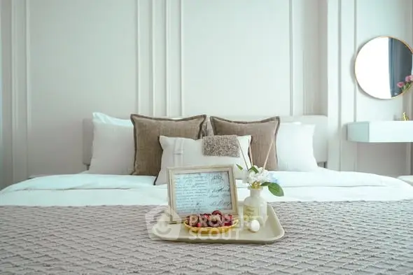 Luxurious bedroom with elegant decor and plush bedding