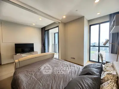 Modern bedroom with city view and balcony access in luxury apartment