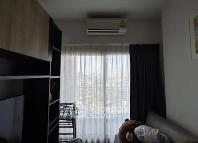 Cozy living room with city view and modern furnishings