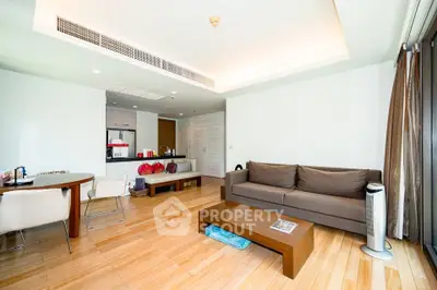 Spacious modern living room with open layout and stylish furniture in a contemporary apartment.