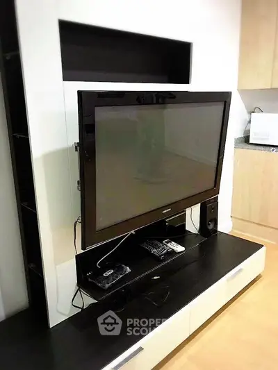 Modern living room with sleek TV setup and stylish cabinetry
