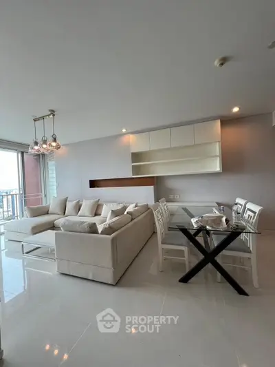 Spacious modern living room with elegant dining area and large windows.