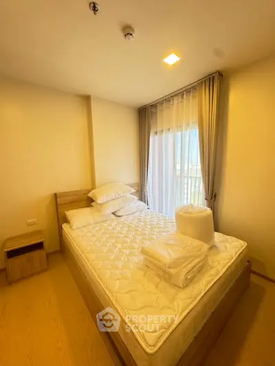 Cozy bedroom with natural light and modern furnishings