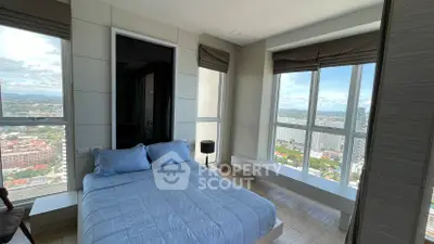 Luxurious bedroom with panoramic city view and modern decor