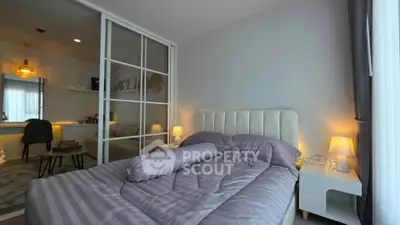 Modern bedroom with cozy lighting and stylish decor, featuring a comfortable bed and elegant furnishings.
