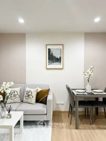 Modern living room with elegant decor and dining area