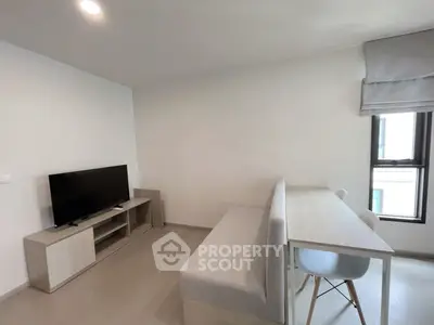 Modern living room with sleek furniture and natural light, perfect for cozy gatherings.