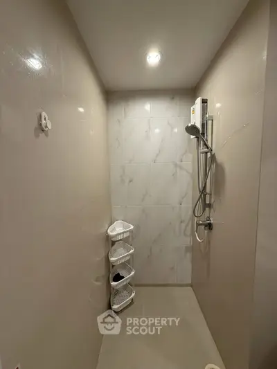 Modern bathroom with sleek shower and tiled walls