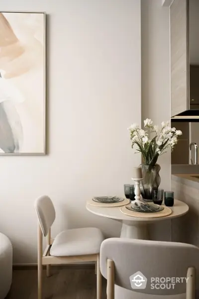 Cozy dining nook with elegant decor and modern art in a stylish apartment