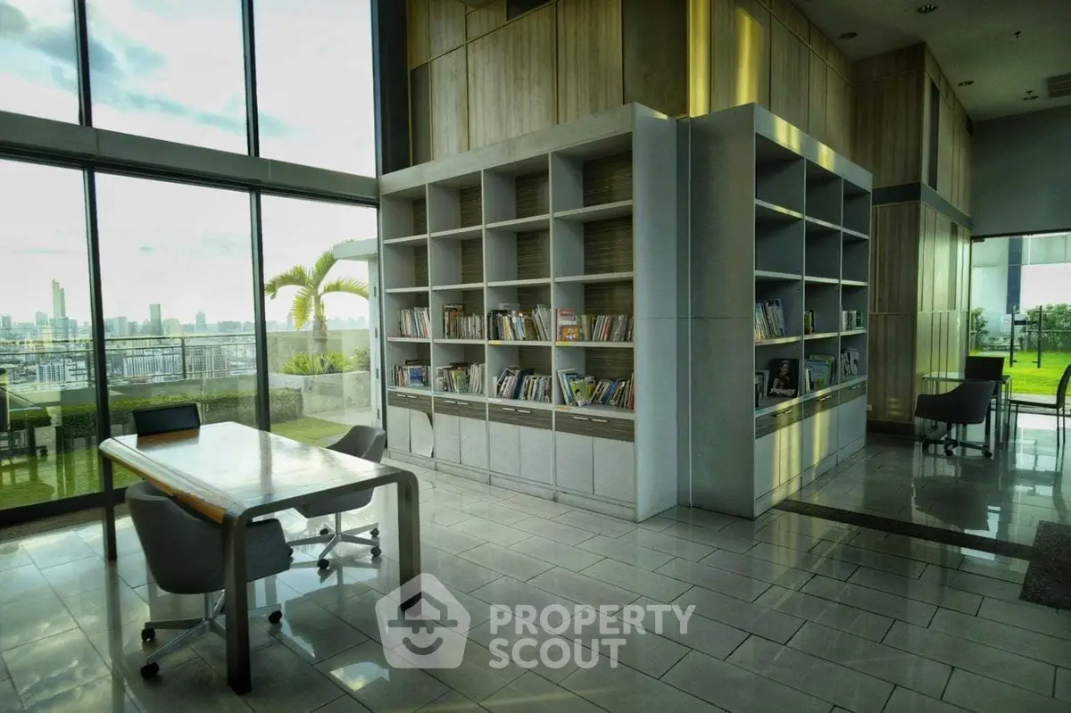 Spacious modern library with city view and elegant furnishings.