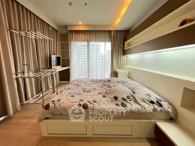 Modern bedroom with stylish decor and large window offering city view