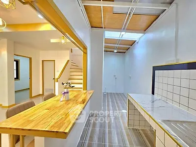Modern kitchen with open layout and wooden accents