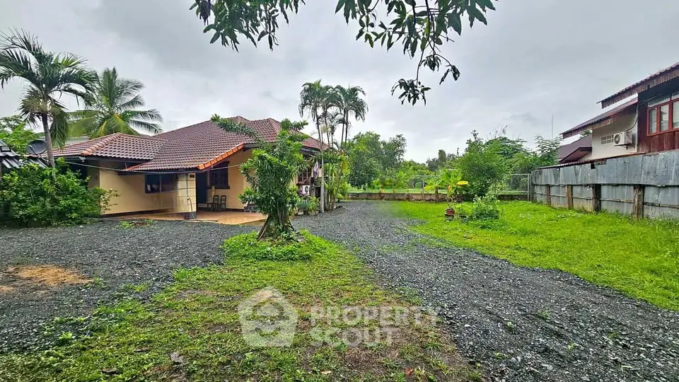Charming countryside home with spacious garden and lush greenery, perfect for serene living.