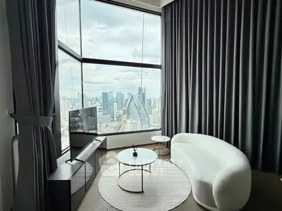 Luxurious living room with panoramic city view and modern furniture