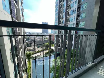 Modern balcony with stunning city view and pool below in high-rise building