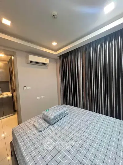 Modern bedroom with air conditioning and stylish curtains in a contemporary apartment.