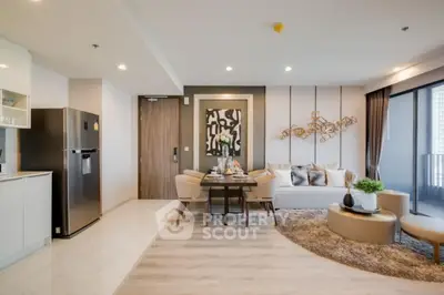 Luxurious open-plan living room with modern decor and stylish furniture in a high-end apartment.