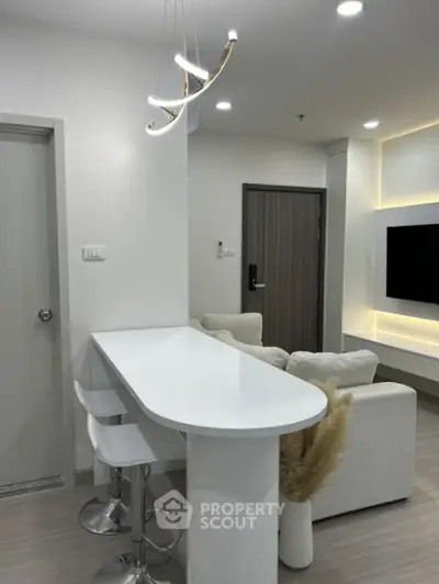 Modern living room with sleek white bar counter and stylish lighting