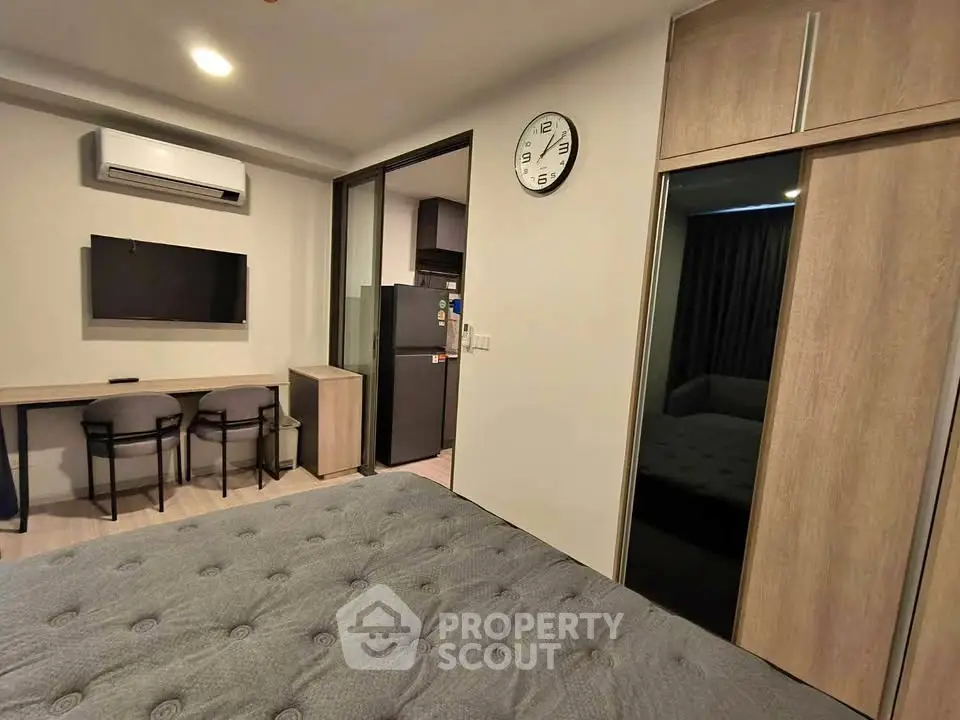 Modern bedroom with air conditioning and stylish decor in a cozy apartment.