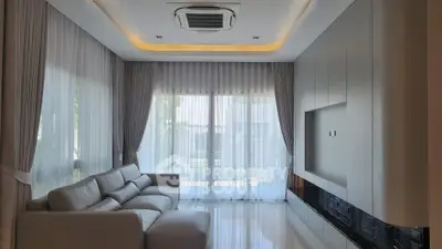 Luxurious modern living room with elegant curtains and sleek sofa