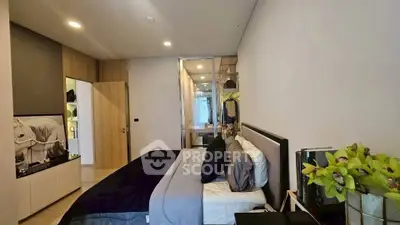 Modern bedroom with stylish decor and ample storage space