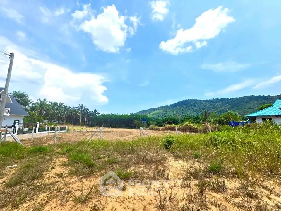 Scenic land plot with mountain views and lush greenery, ideal for development or investment.
