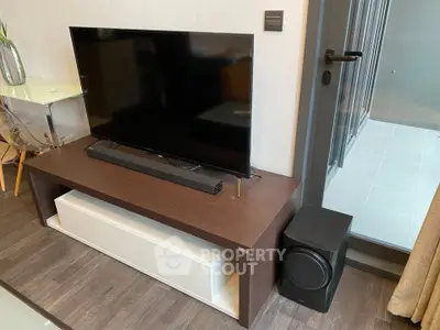 Modern living room with sleek TV setup and stylish furniture
