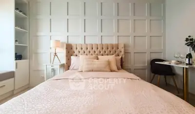 Elegant bedroom with tufted headboard and stylish decor, perfect for modern living.