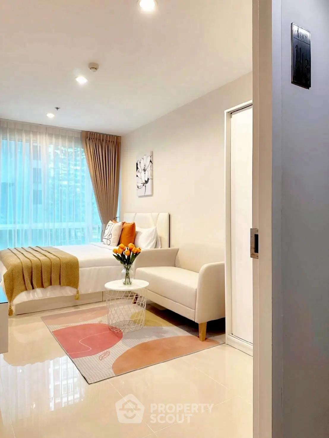 Modern studio apartment with cozy living area and stylish decor