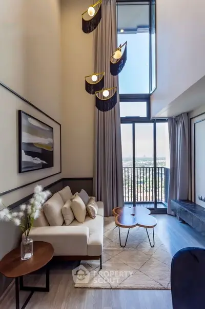 Stunning modern living room with high ceiling and balcony view, featuring elegant decor and natural light.