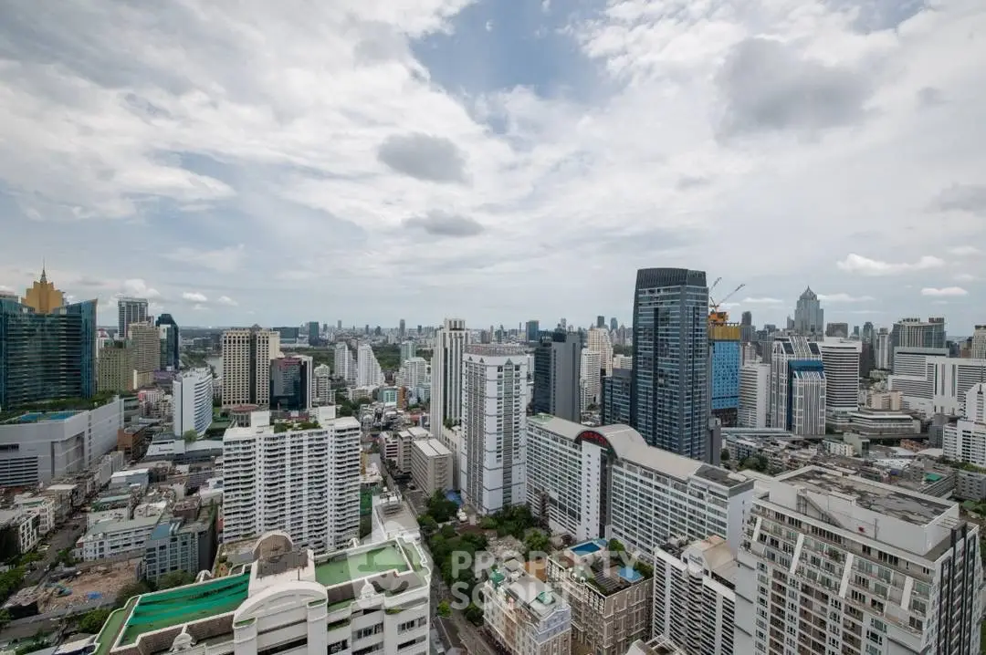Stunning cityscape view from a high-rise building, showcasing urban skyline and architectural diversity.
