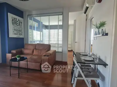 Modern living room with stylish decor and cozy seating in a contemporary apartment.